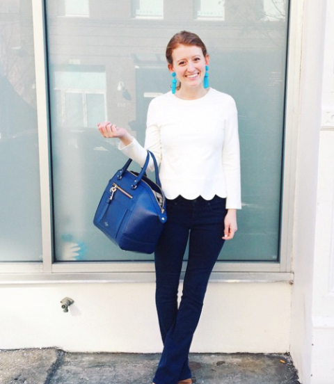 With flare trousers and blue bag
