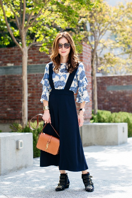 With floral blouse, black ankle boots and brown leather bag