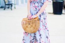 With floral maxi dress, pink heels and hat