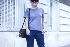 With gray t-shirt, crop jeans and black bag