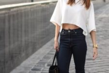 With high-waisted jeans, slip on shoes and tote