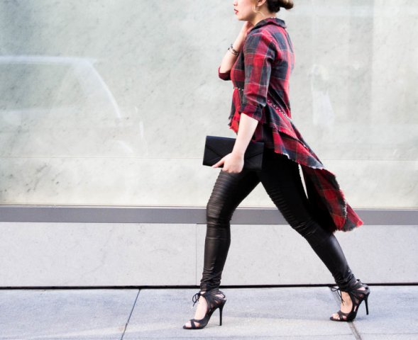 With leather leggings, shoes and clutch
