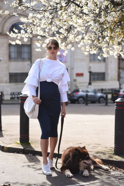 With navy blue midi skirt, white sneakers and white bag