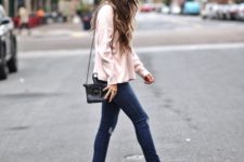 With shirt, skinny jeans and black bag