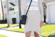 With sporty dress and black leather crossbody bag