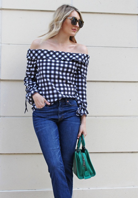 With straight jeans and green bag