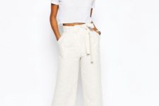 With white crop t-shirt and silver flat sandals
