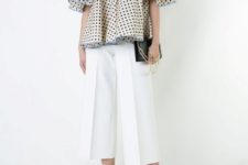 With white culottes, black clutch and white shoes
