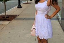 With white lace dress and pale pink bag