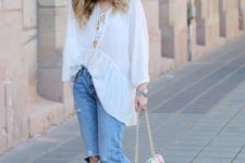 With white loose blouse, jeans and printed bag