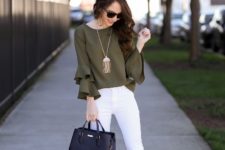 With white pants, beige pumps and leather bag