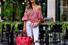With white pants, red big bag and beige sandals