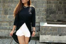 With white scallop shorts and cutout boots