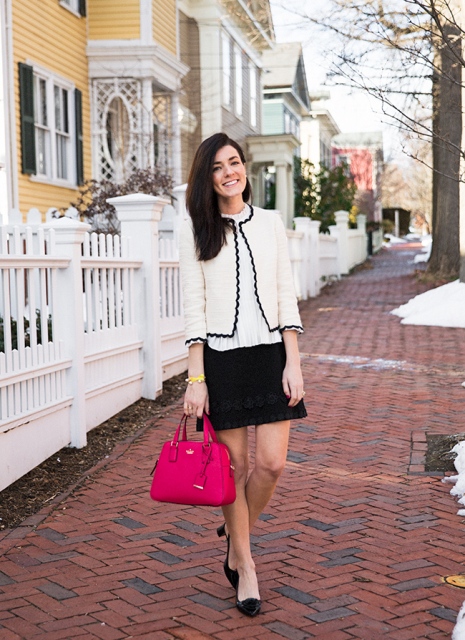 With white shirt, black mini skirt, black shoes and red bag