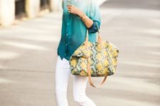 With white skinny pants, sandals and printed tote