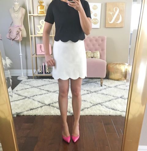 With white skirt and pink pumps