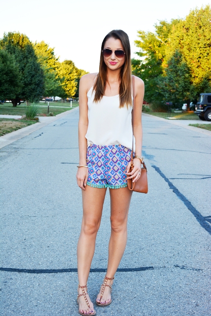 With white top, flat sandals and brown mini bag