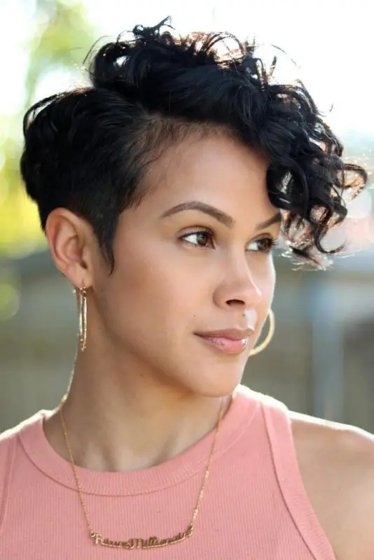 a black long curly pixie cut is a charming idea wiht a lot of edge, make sure that the length works with your natural curl pattern