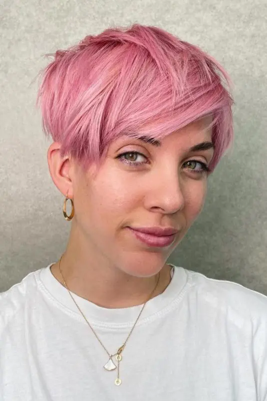 a messy asymmetrical long pixie in pink is a gorgeous idea if you want some drama, and this color will catch an eye