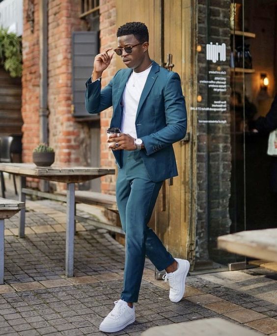 a modern graduation outfit with a blue suit, a white t-shirt, white sneakers is a cool idea not only for graduation