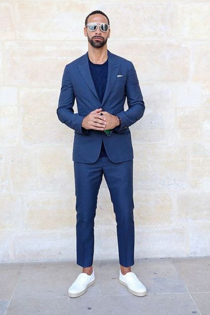 A pretty modern graduation look with a navy pantsuit, a navy t shirt, white slipons is a cool and classy idea