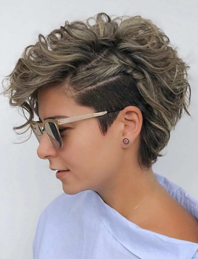 an asymmetrical messy wavy long pixie with a longer length to let more waves into your life, wave the top, setting it to one side with a good texturizing product