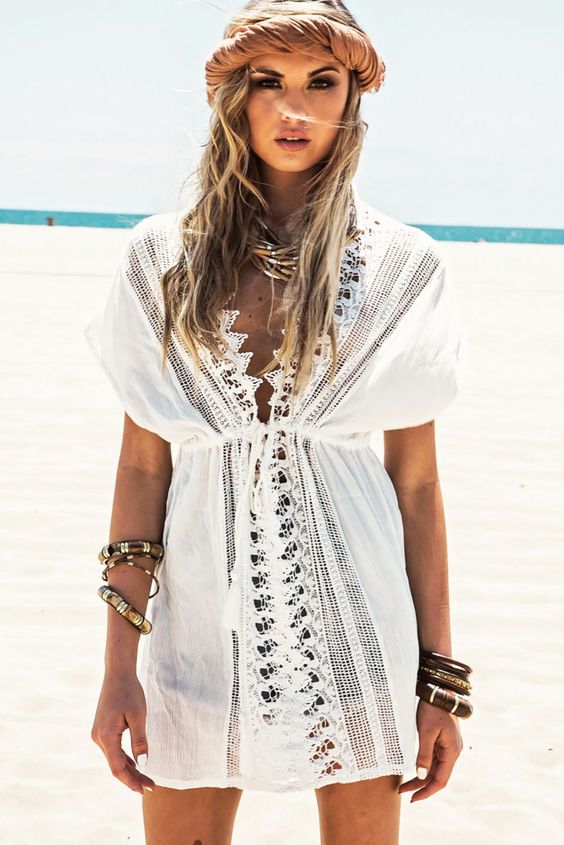 a sexy white beach tunic with a lace trim and a V-neckline plus short sleeves