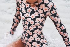 03 a black one piece swimsuit with a pink floral prints for active sporty girls