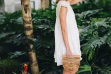 07 a short white dress with lace detailing, wedges and a wooden clutch