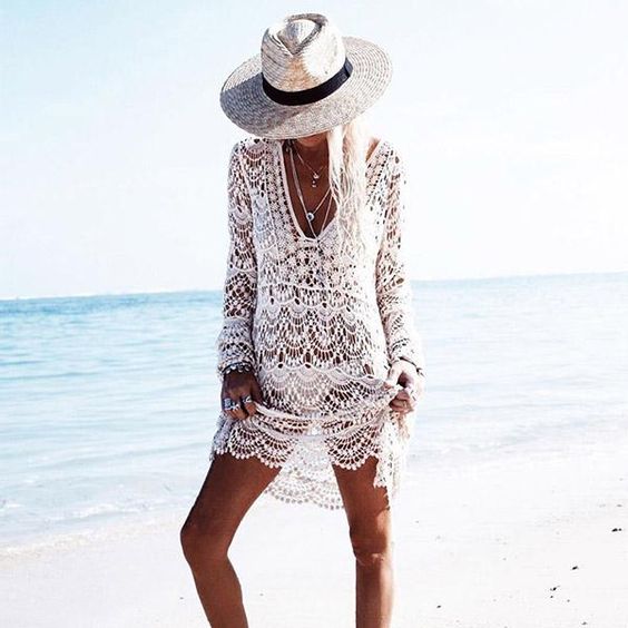 a sexy white crochet beach tunic with long sleeves for a boho girl or for honeymoon