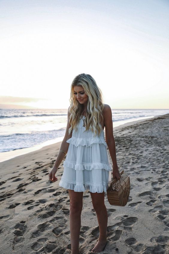 a white ruffled mini dress is a timeless idea, suitable for many girls