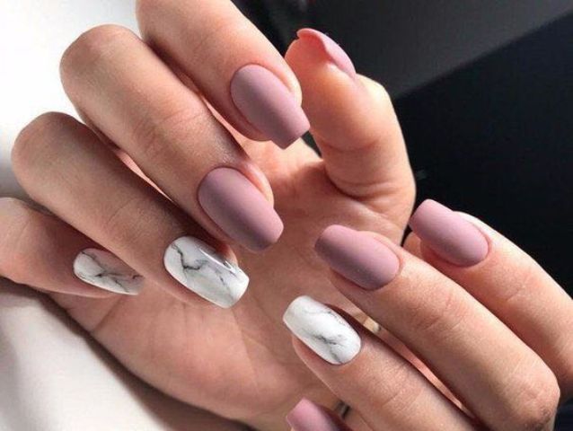 matte mauve nails with white marble accents is a trendy and edgy idea