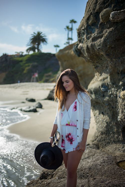 a cute floral romper with a V-necckline is great for walking on the beach