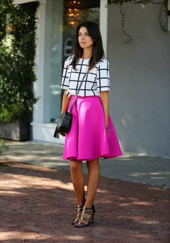 a hot pink A-line skirt, a windowpane top and blakc strappy shoes
