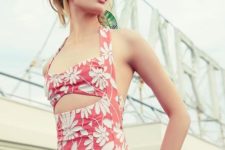10 a vintage-inspired pink one piece floral swimsuit with a cutout and thick straps