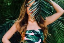 15 a two piece swimsuit with a pink palm leaf printed top and a striped high waisted bottom