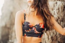 16 a vintage-inspired black floral two piece swimsuit with a high waisted top