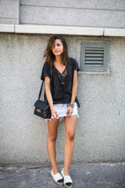 With black loose shirt, black and white shoes and black bag