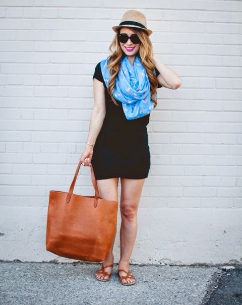 With black mini dress, blue scarf, hat, tote bag and brown sandals