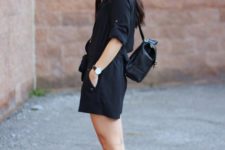 With black romper and black sandals
