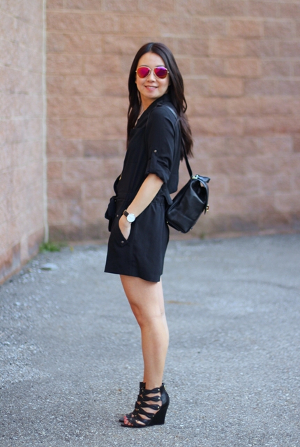 With black romper and black sandals