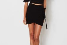 With black wrap skirt and heels