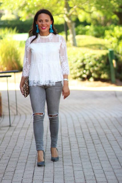 With gray jeans, gray heels and leopard clutch