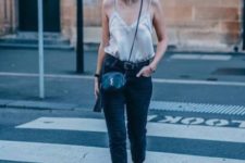 With jeans, black shoes and black leather mini bag