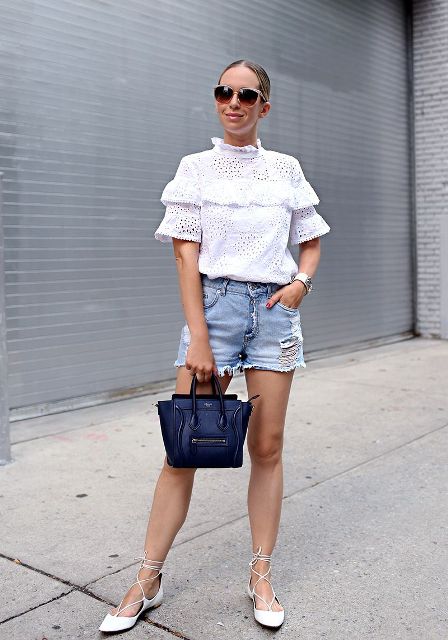 With lace blouse, lace up flats and leather bag