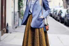 With light blue blouse, midi skirt, oversized blazer and mini bag