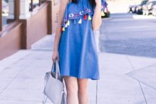 With light gray bag and lace up sandals