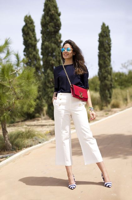 With navy blue blouse, white culottes and red chain strap bag