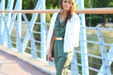 With olive green jumpsuit, red high heels and white blazer