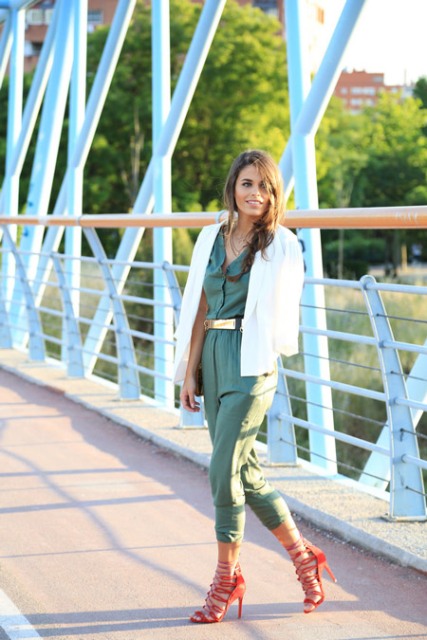 With olive green jumpsuit, red high heels and white blazer